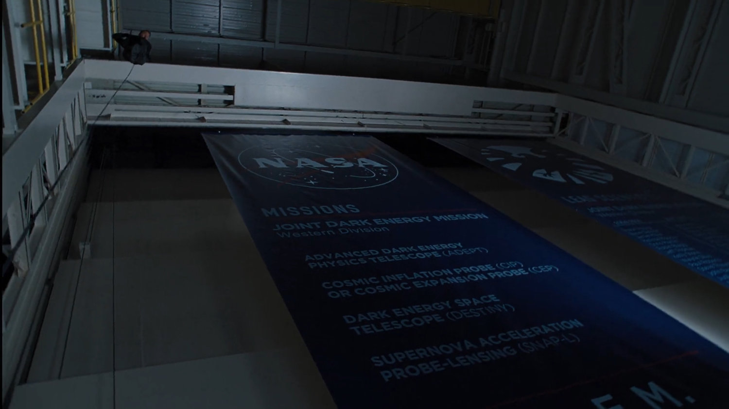 NASA banners hang in the interior of the Joint Dark Energy Mission.