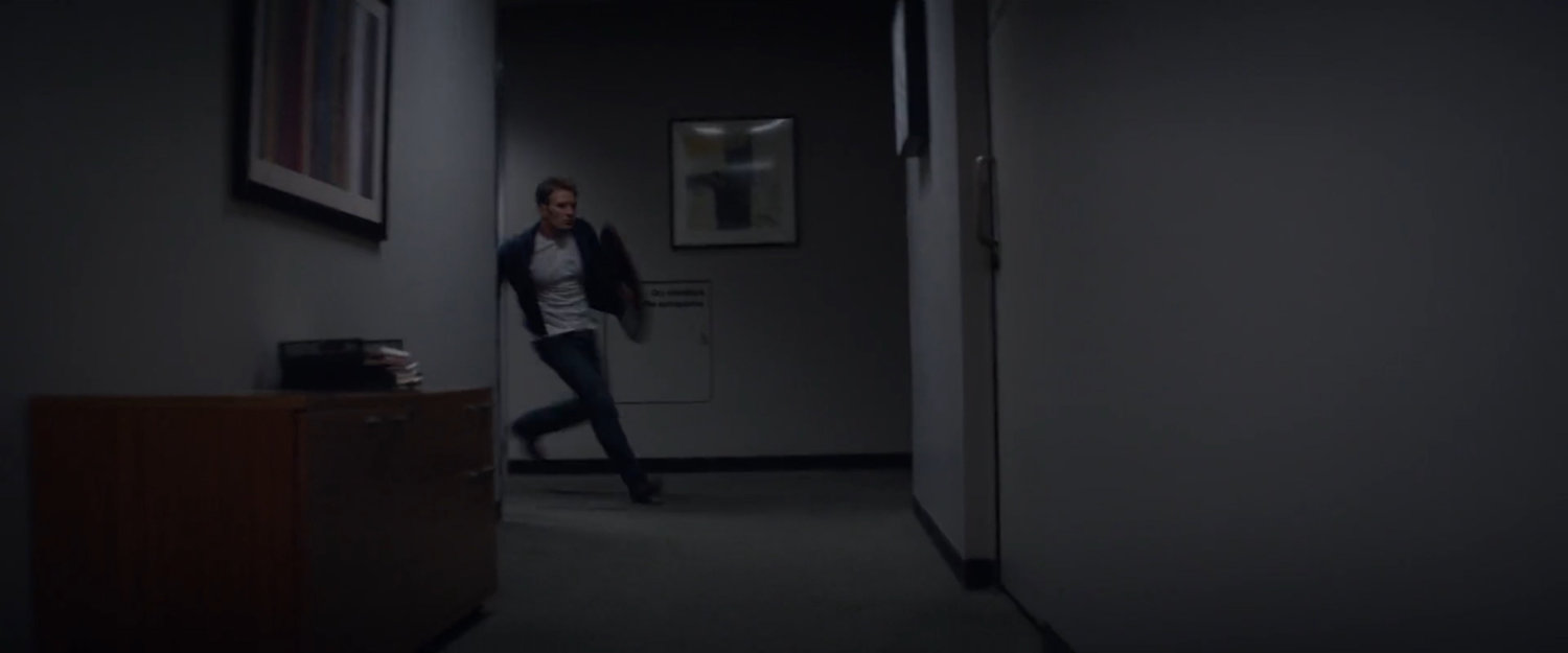 Steve Rogers running through office hallway.