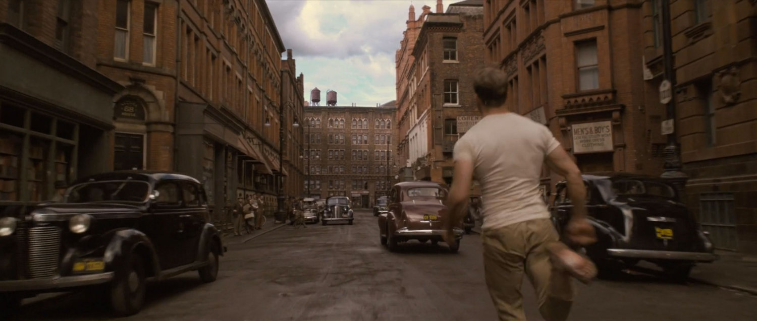 Steve Rogers running down a 1942 New York street.