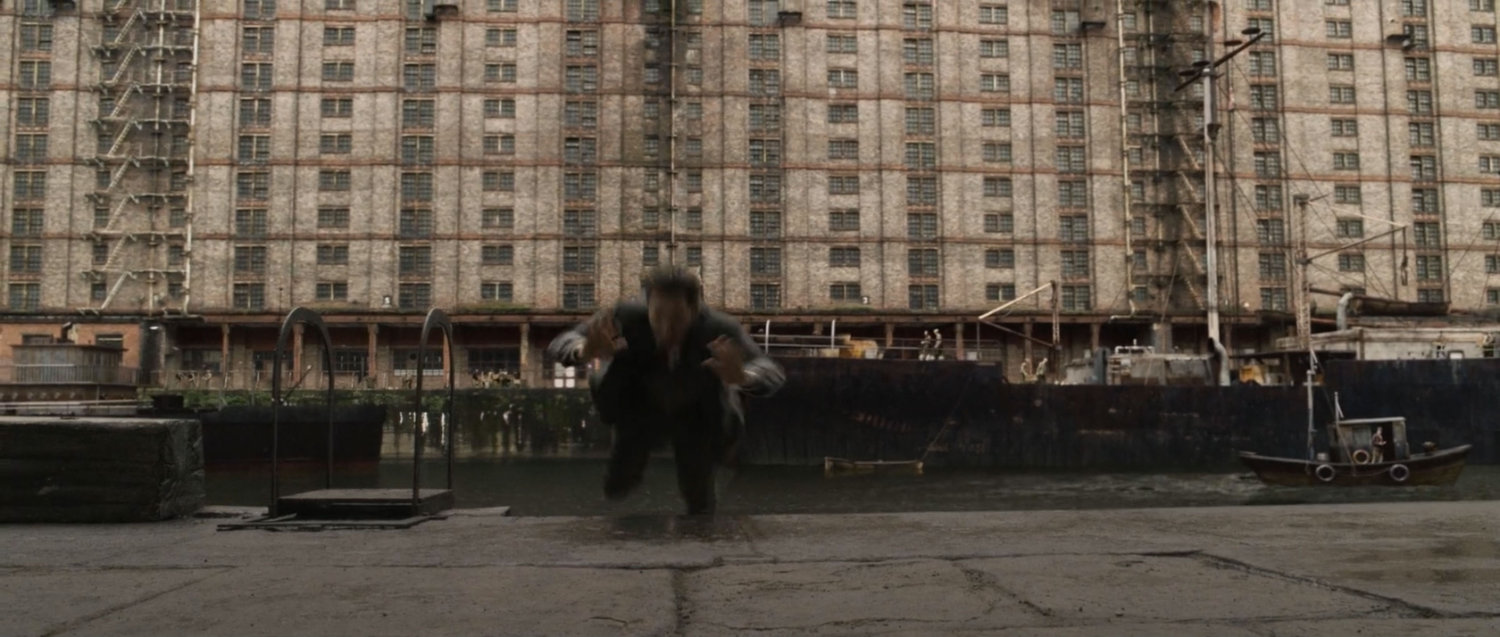 A man being thrown onto a pier at the docks.