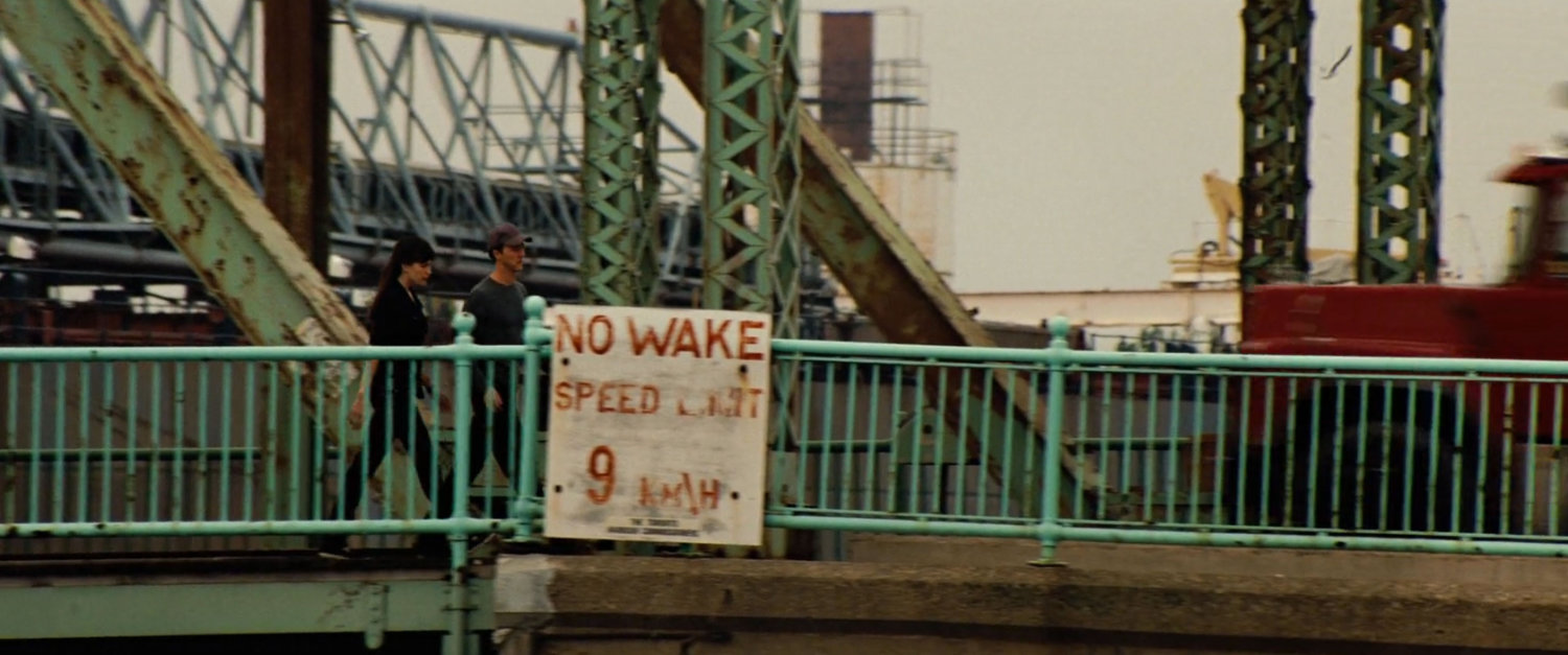Bruce and Betty walk across a bridge.