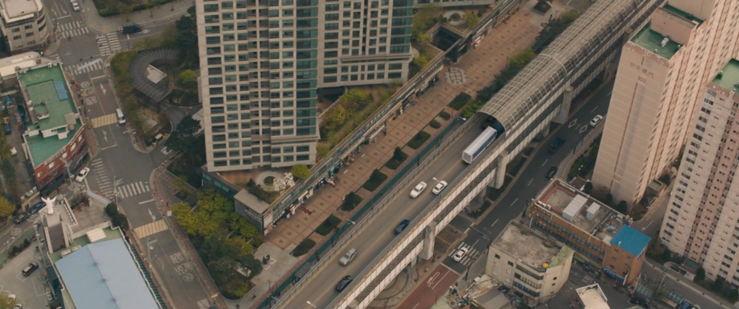 Aerial view of U-Gin truck on bridge.