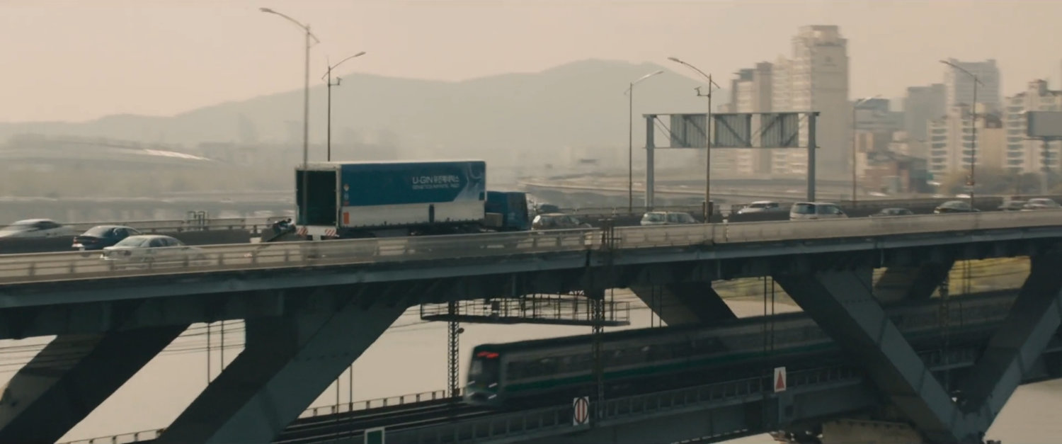 Aerial view of U-Gin truck on bridge.