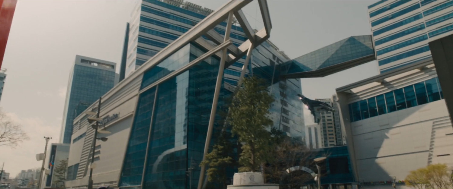 Quinjet flying past hi-tech building in Seoul Korea.