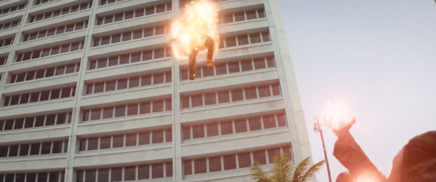 A hovering body bursts into flames outside a giant office building in Lagos.