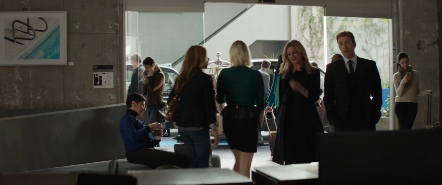 Sharon Carter and Steve Rogers in a busy hotel lobby.