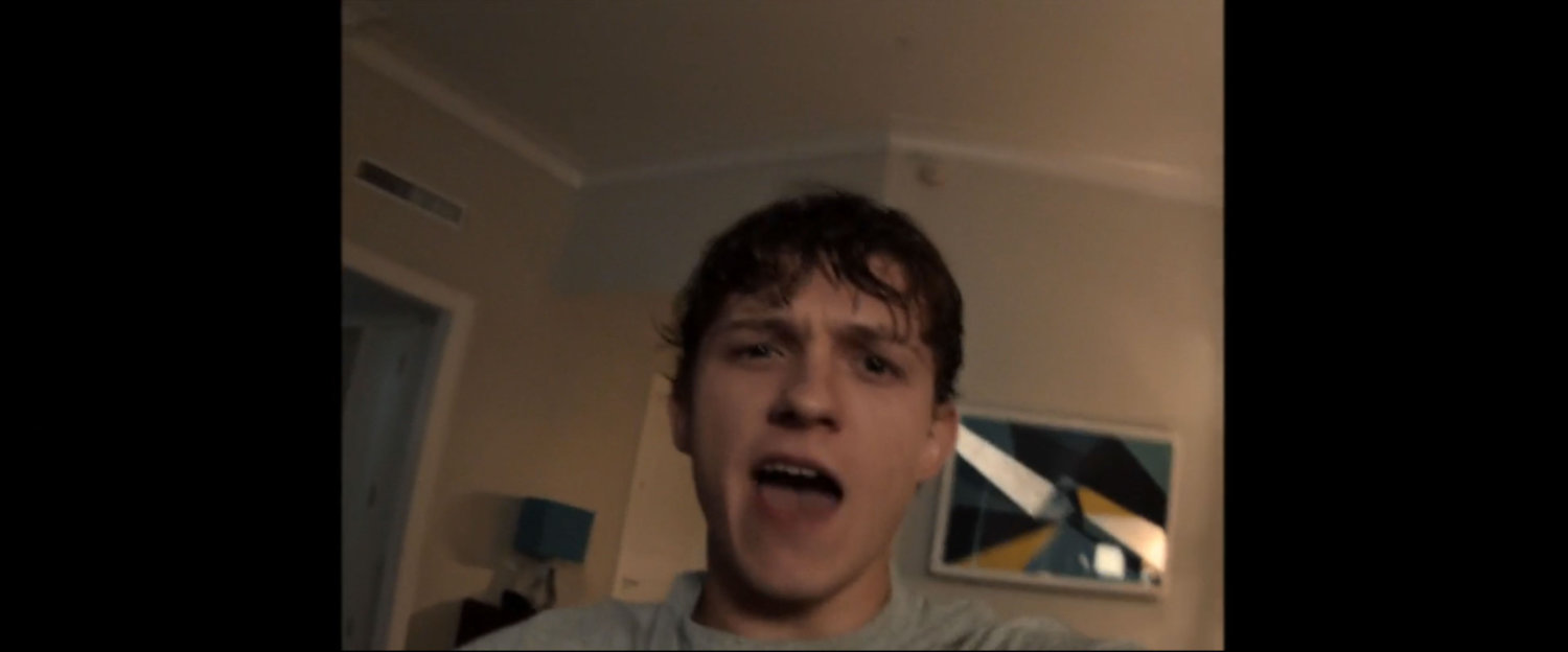 Close up of Peter Parker in a hotel room.