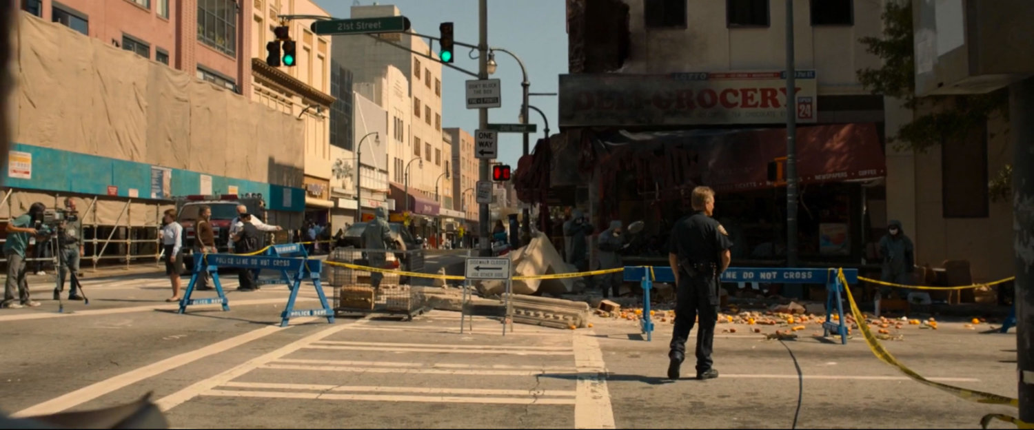 New York street corner cordoned off with damaged and burned Delmar's grocery. 