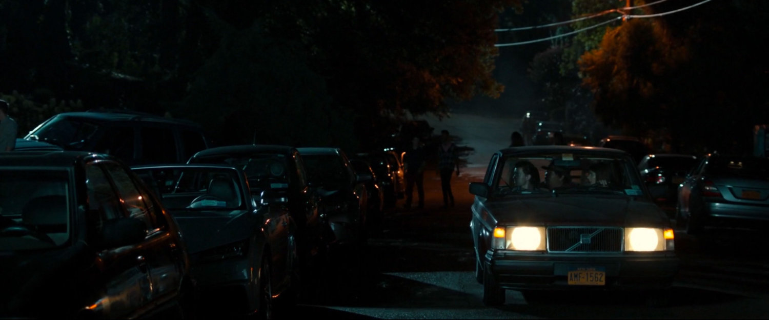Cars parked on street out in front of Liz's house.