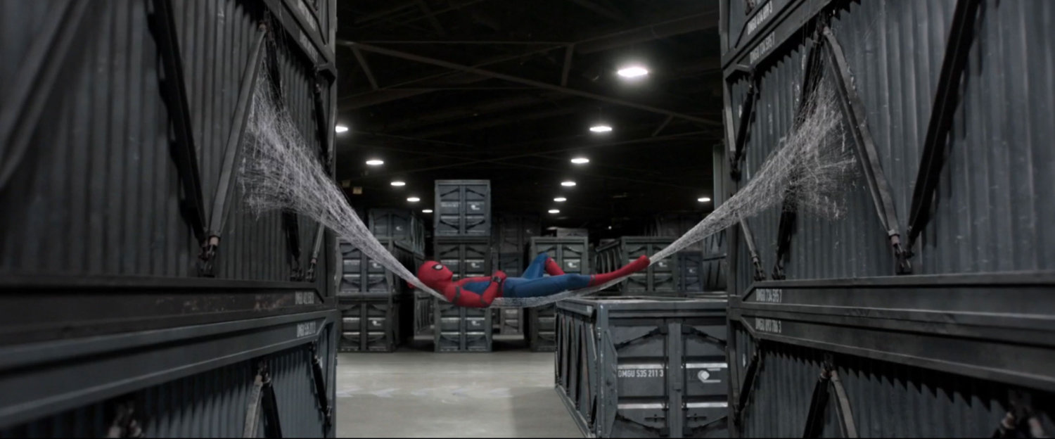 Spider-Man resting on a web-hammock inside Department of Damage Control.