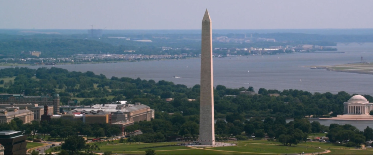 Aerial view of the Washington Monument, with Jefferson Memorial in distance..