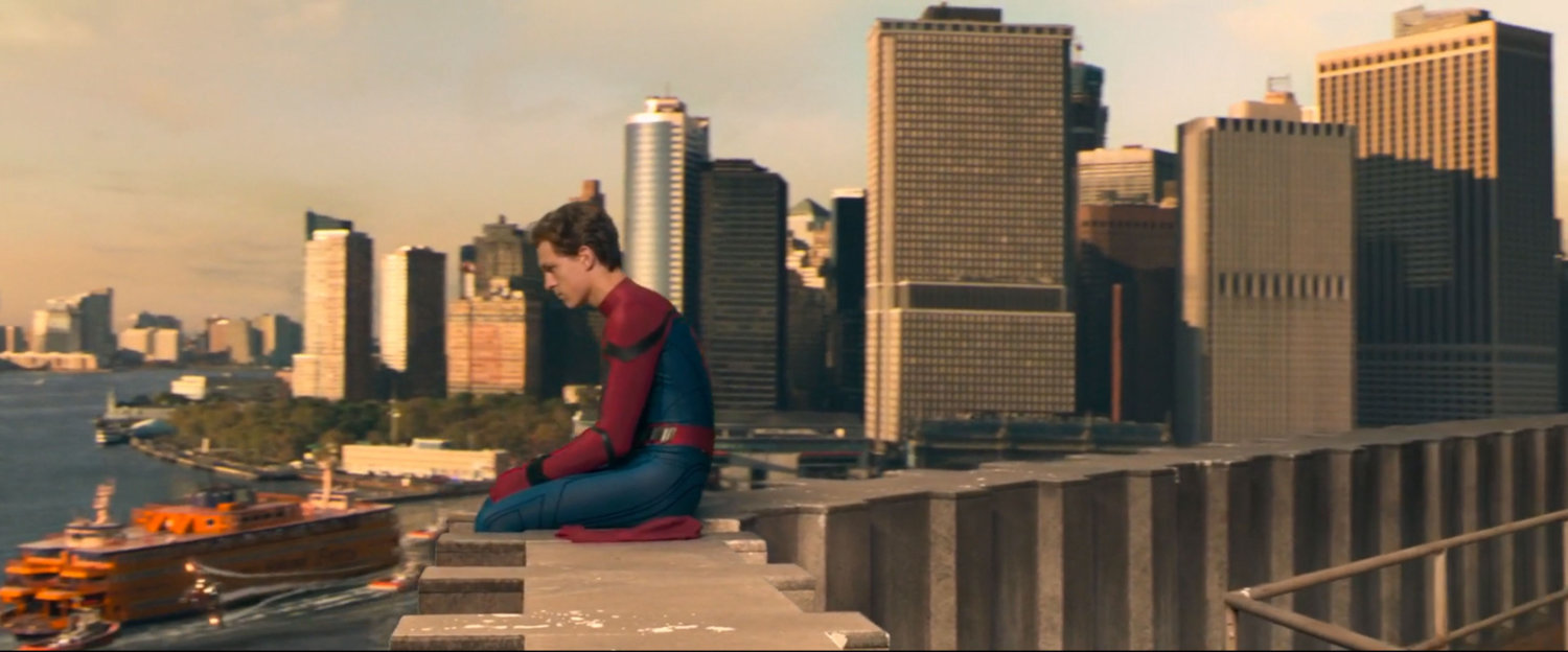 Peter sitting on the edge of the Brooklyn Battery Tunnel Ventilation Building.