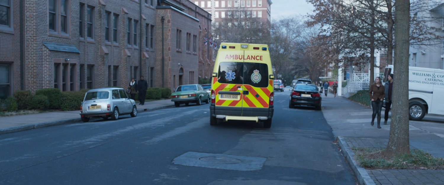 An ambulance speeds off down a London street.