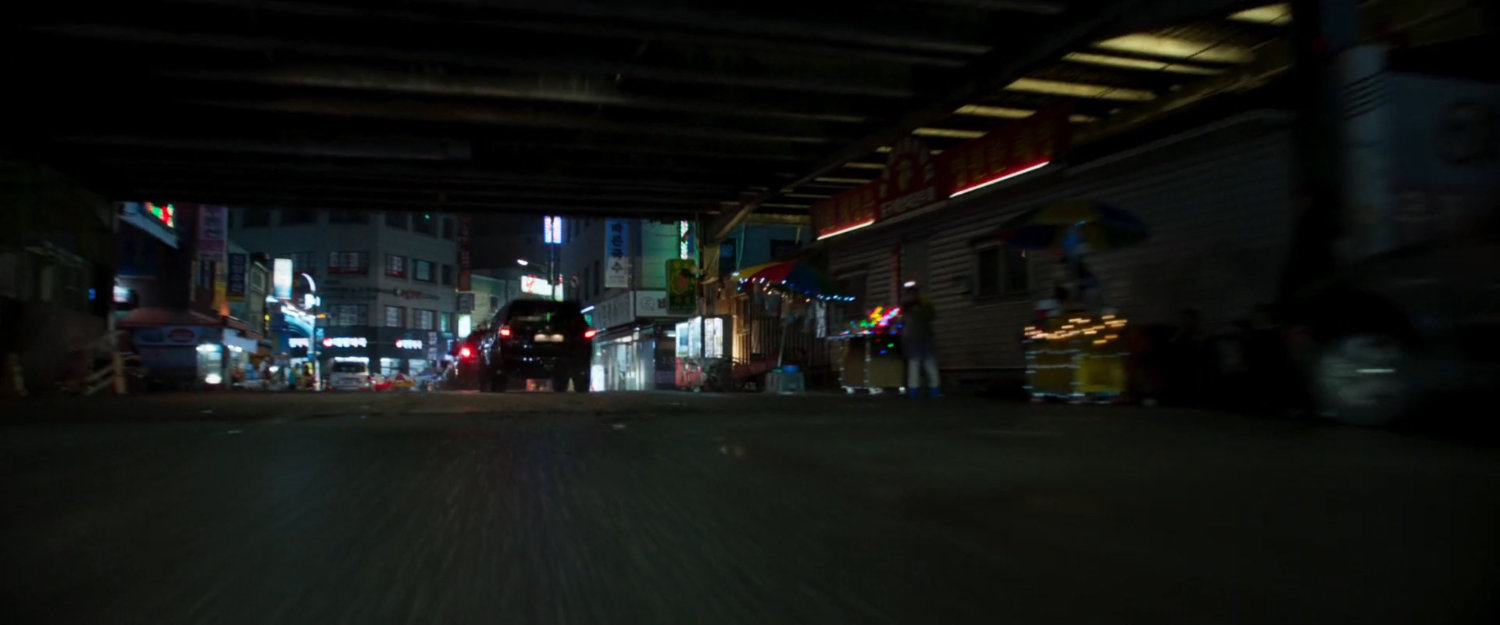 SUVs driving on a Busan street.