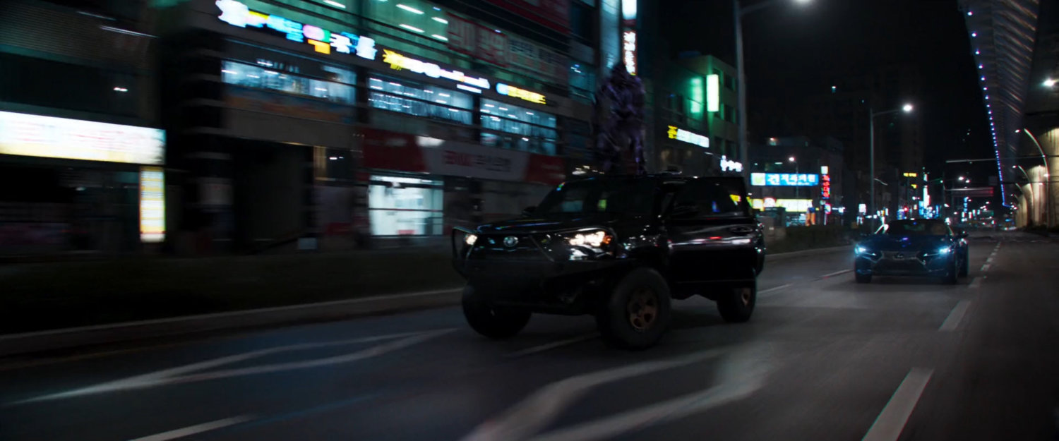 Car in pursuit of SUV on a Busan road.