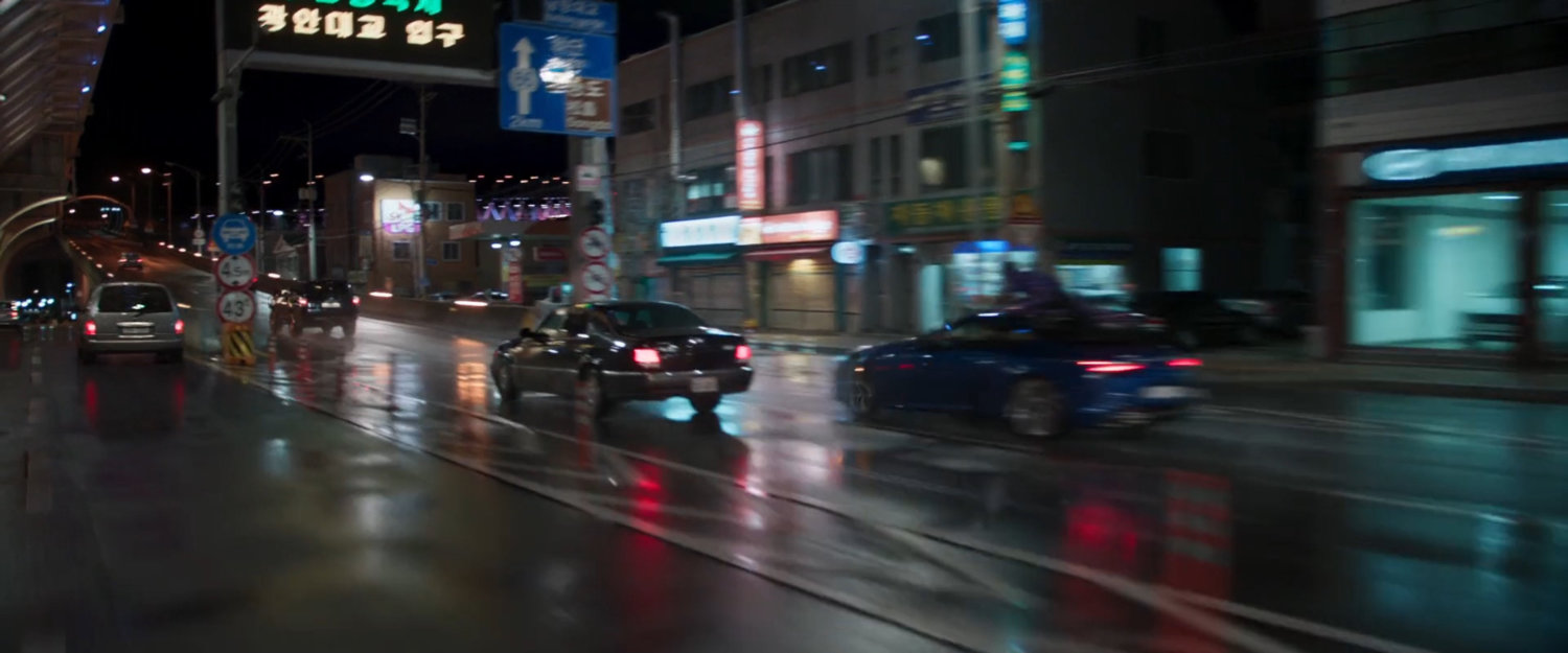 Cars taking off ramp for Busan bridge.