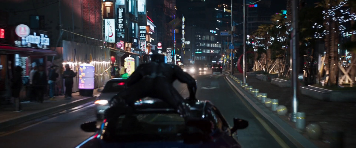 Black panther on top of car racing down Busan street.