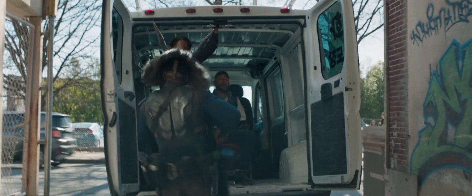 Killmonger puts Klaue in the back of a white van.