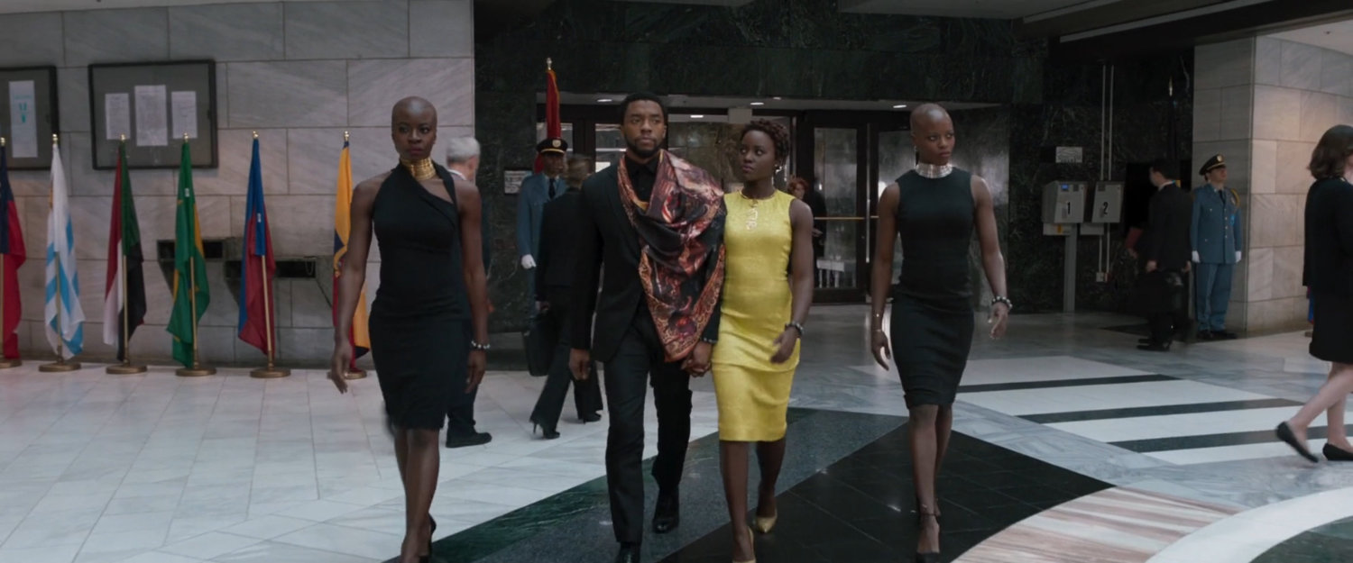 Okoye, T'challa, Nakia, and Ayo enter the United Nations building.