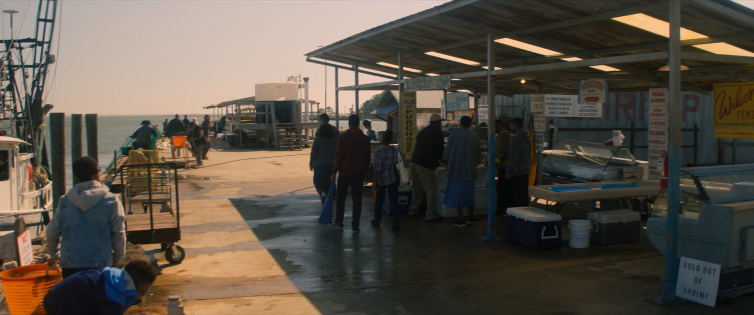 People at the Wilson Family Seafood pier.