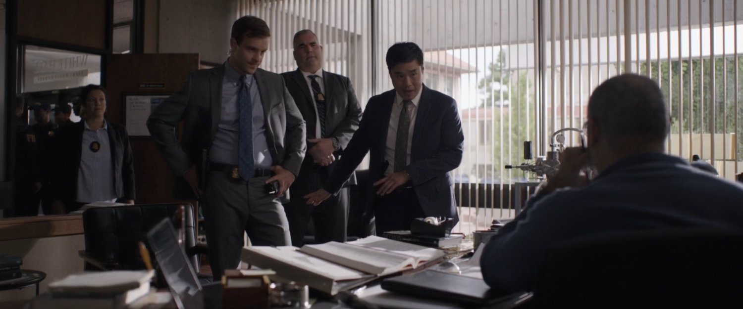 Agents inside of Bill Foster's office.