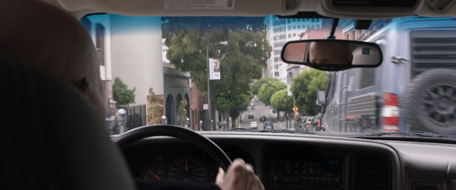 POV of SUV chasing van on San Francisco street.