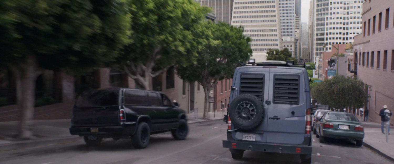 SUV chasing van on San Francisco street.