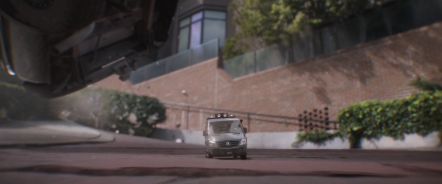Shrunken van drives along Lombard Street.