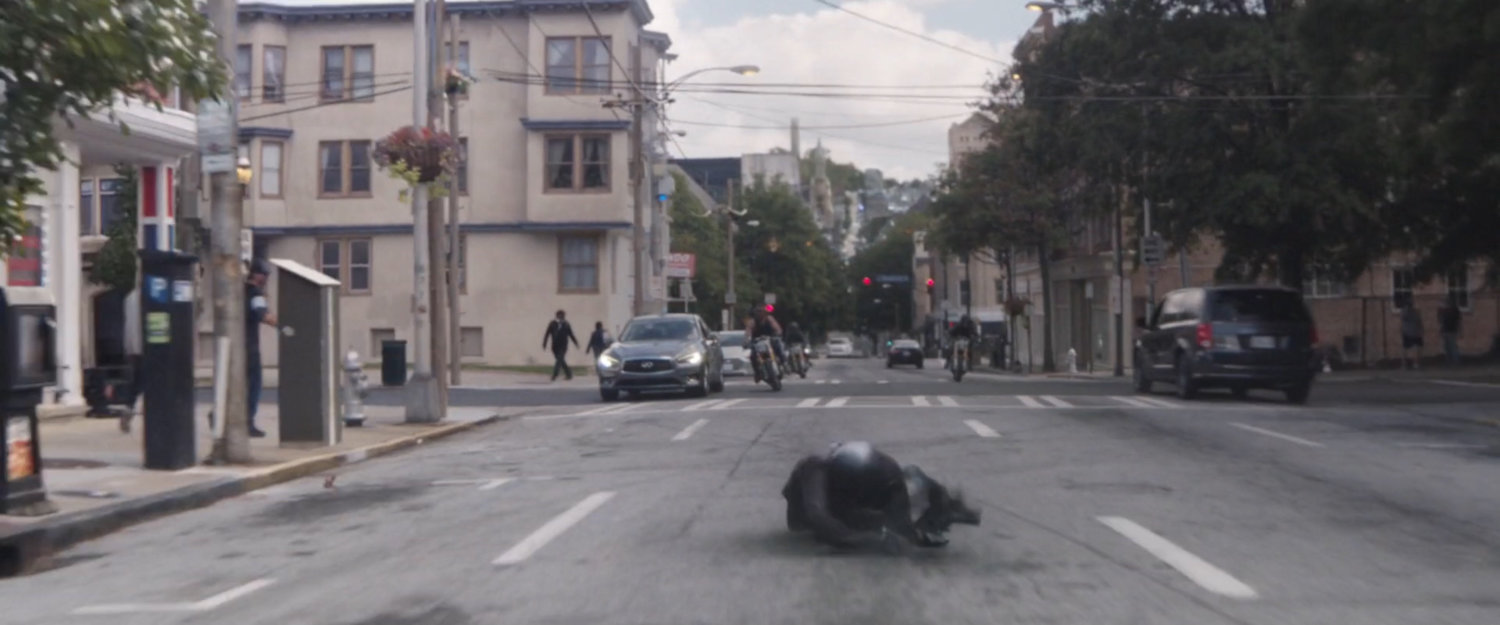 A motorcycle crashes in the middle of a San Francisco street.