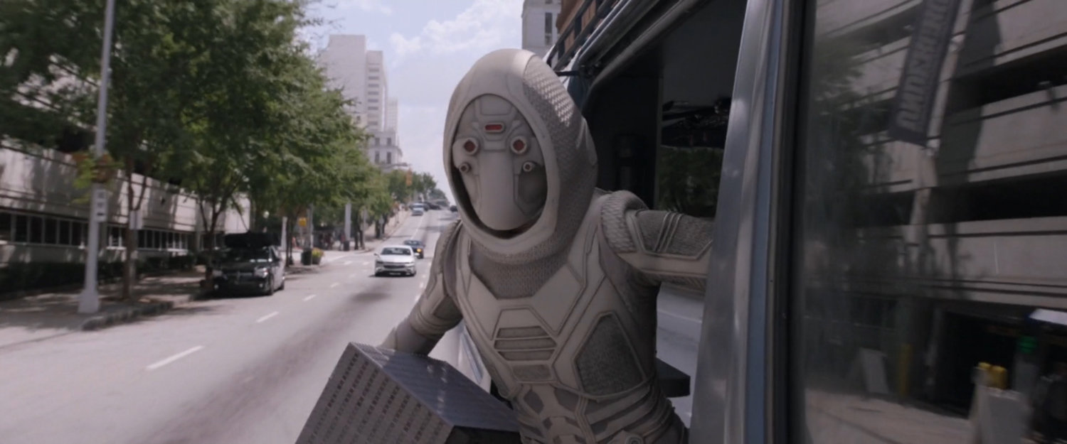 The Ghost stepping out of van with miniature Pym Lab.
