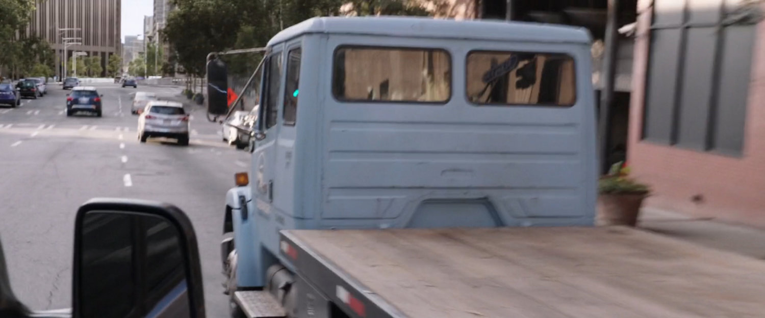 The back of a flatbed truck on a San Francisco street.
