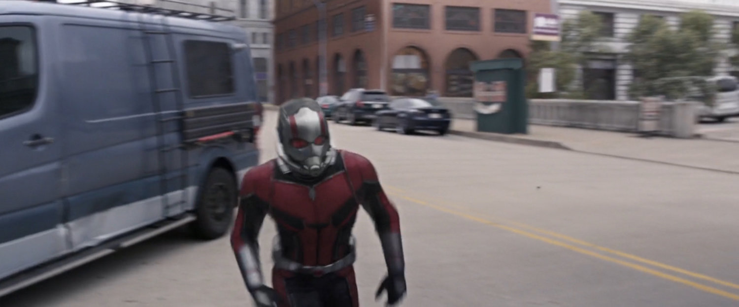 Ant-Man next to crashed van.