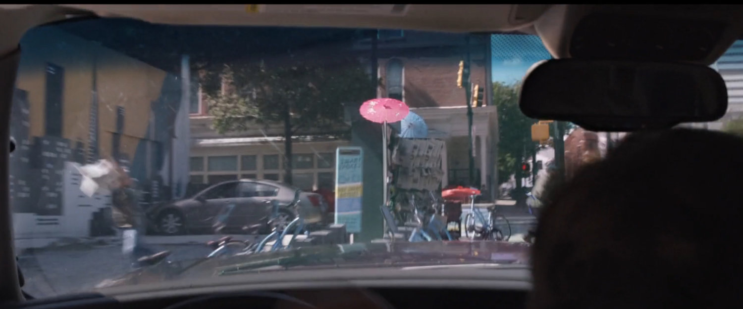 POV from inside SUV as it crashes into parked bicycles.