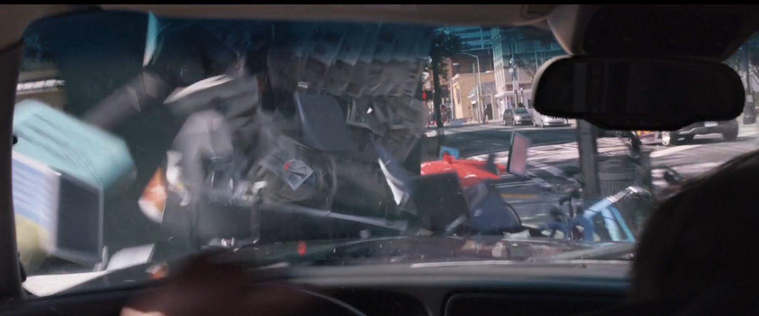 POV from inside SUV as it crashes into parked bicycles.