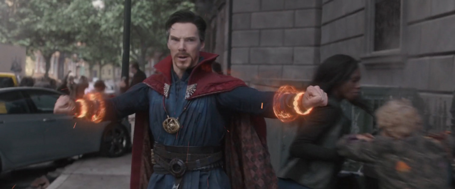 Doctor Strange powering up for a fight on a street corner.