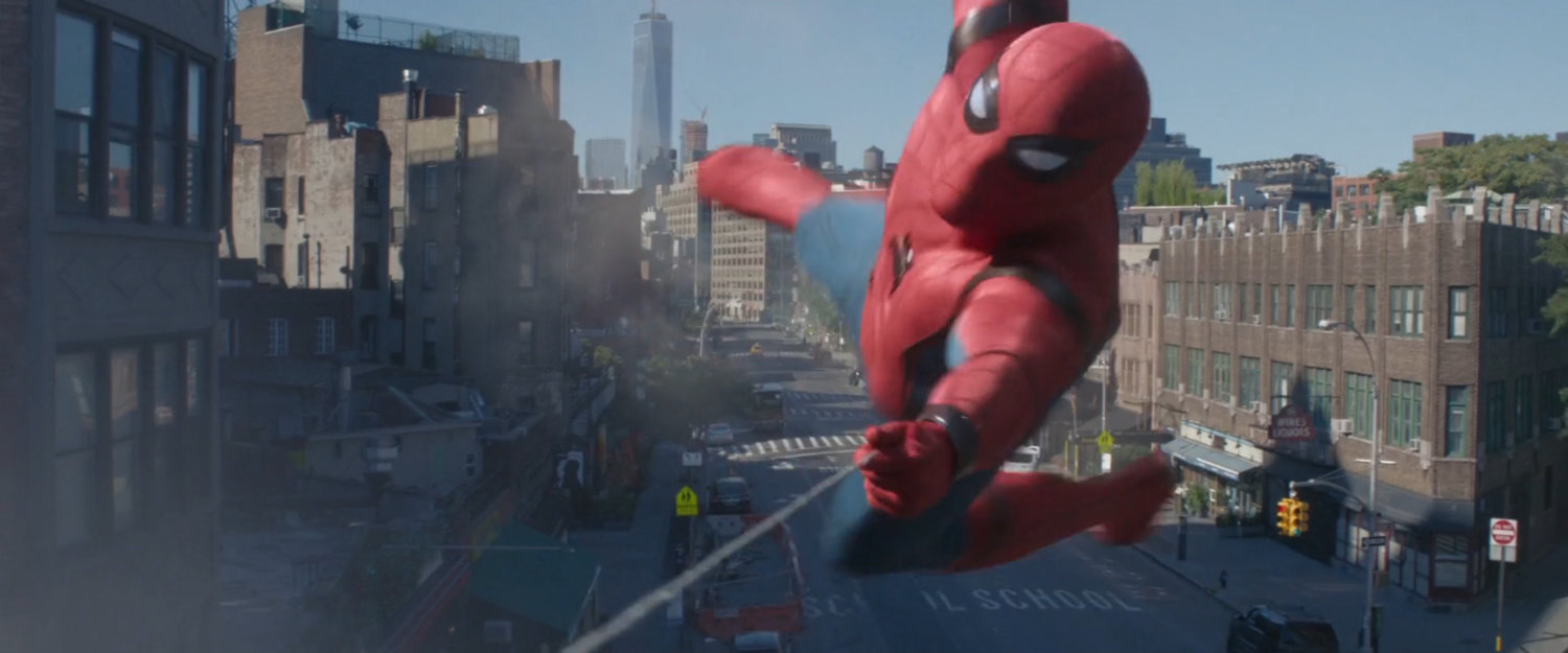 Close up of Spider-Man swinging over a New York square.
