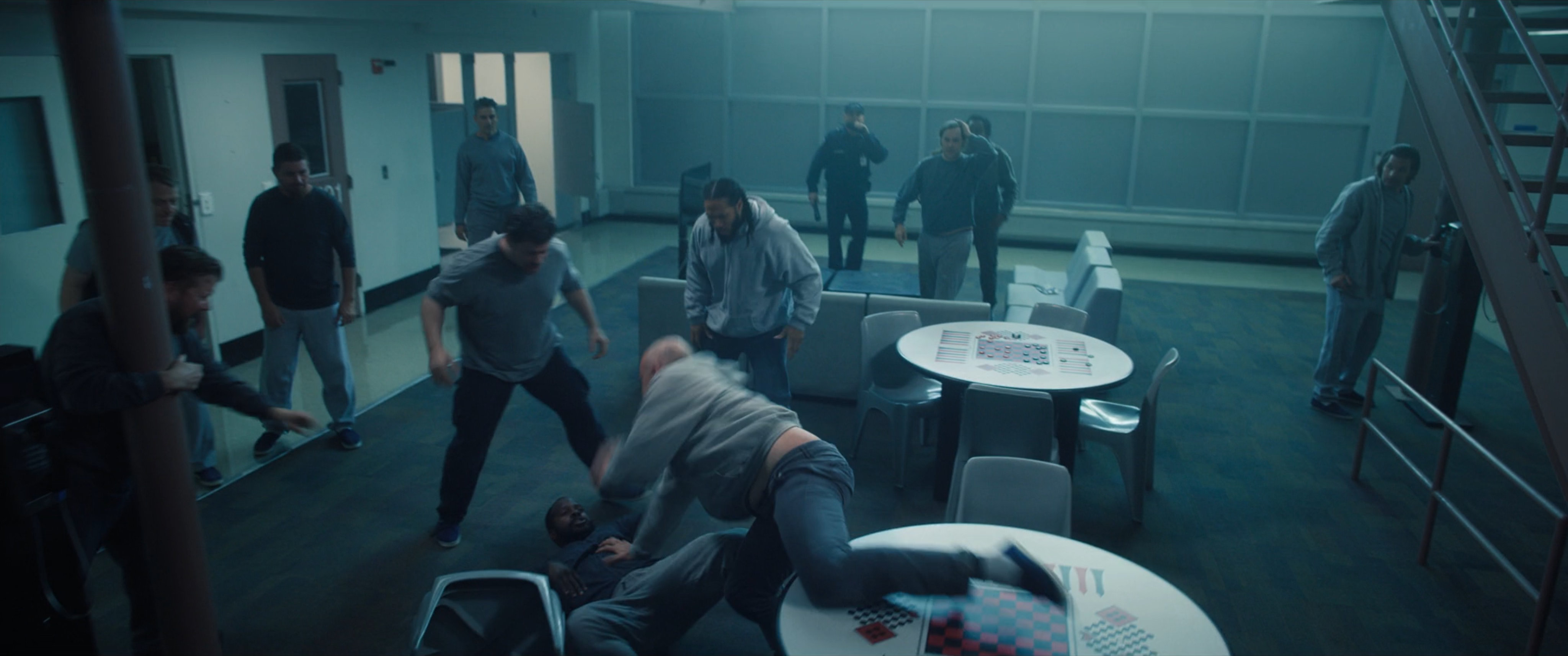 Prisoners fighting in a common room.