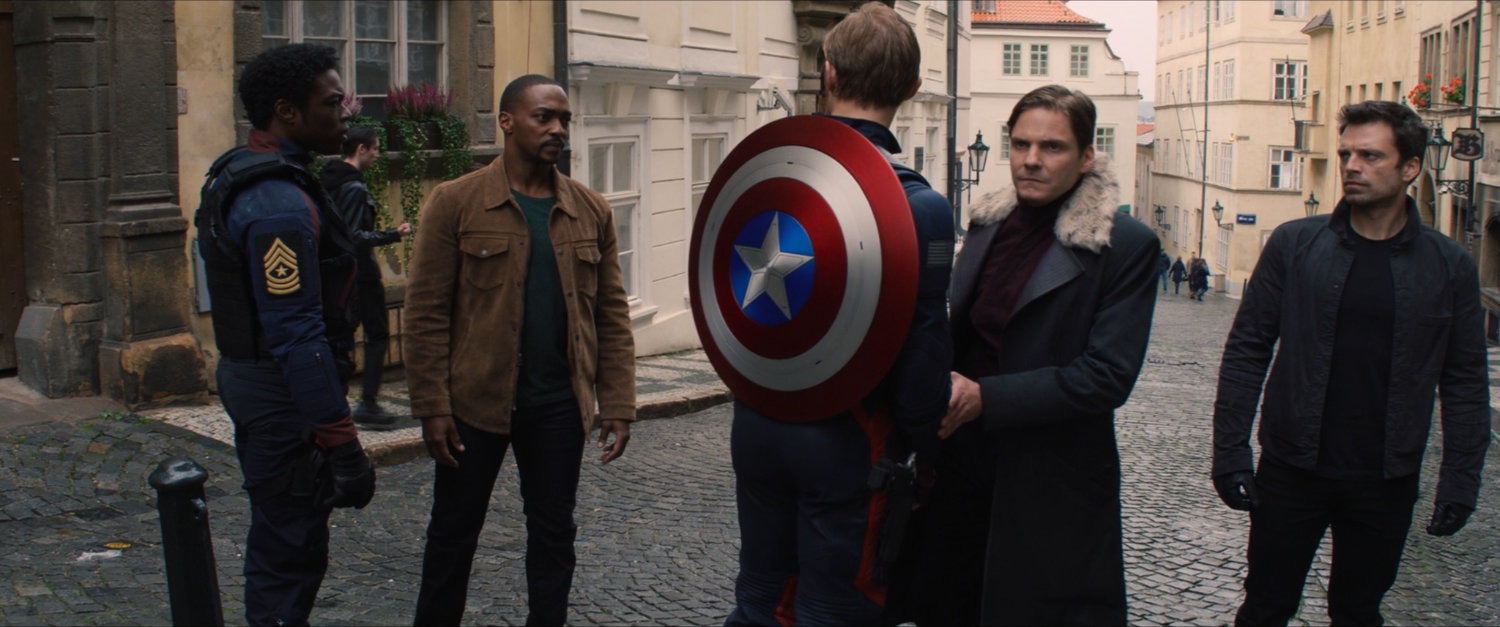 John Walker, Lamar, Sam, Bucky and Zemo on a Latvian street.