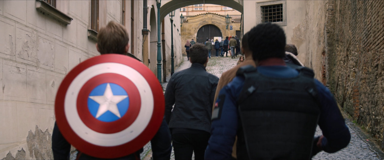 John Walker, Lamar, Sam, Bucky and Zemo on a Latvian street.