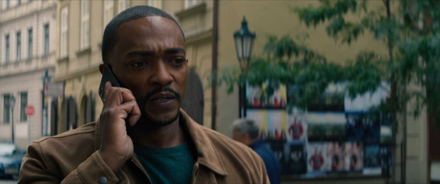 Sam on the phone on a Latvian street.
