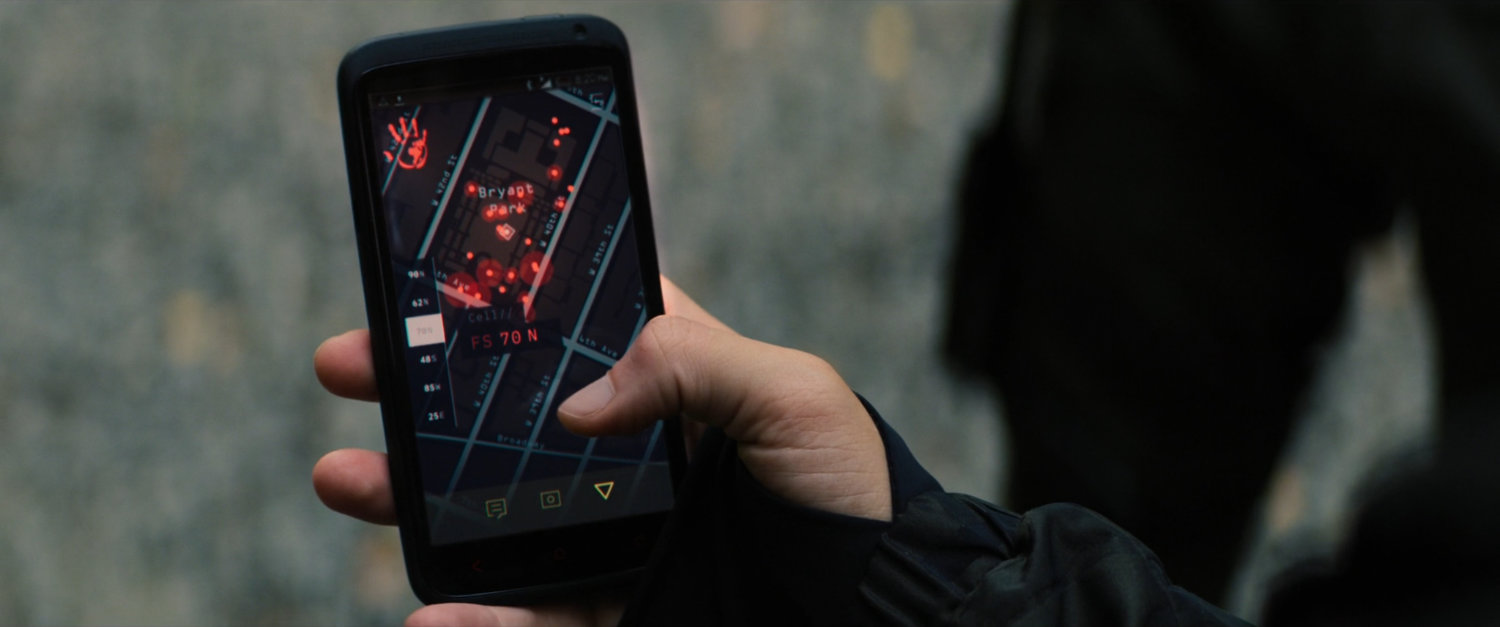 Close up of hand holding phone with the Flag Smasher app open.