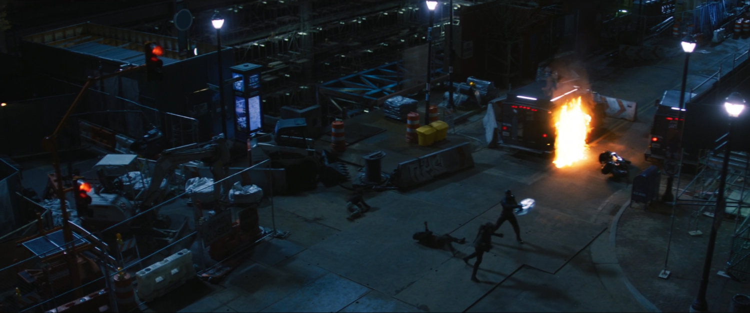 Bucky and John fight on a New York street.