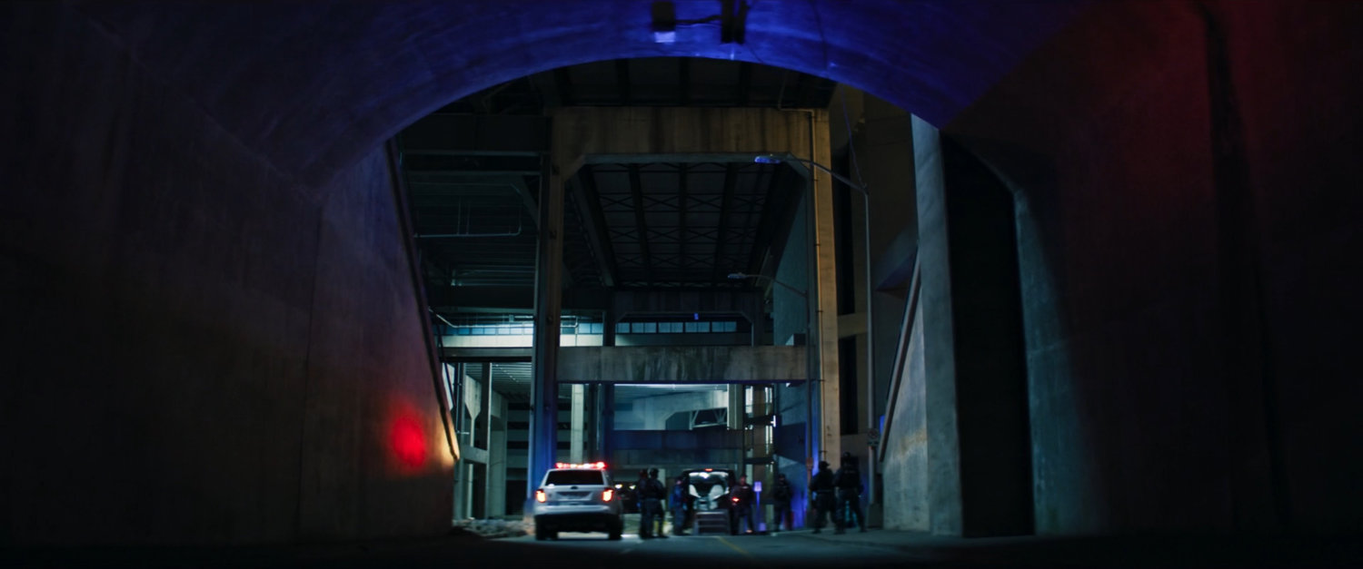 Cars in underground parking structure.