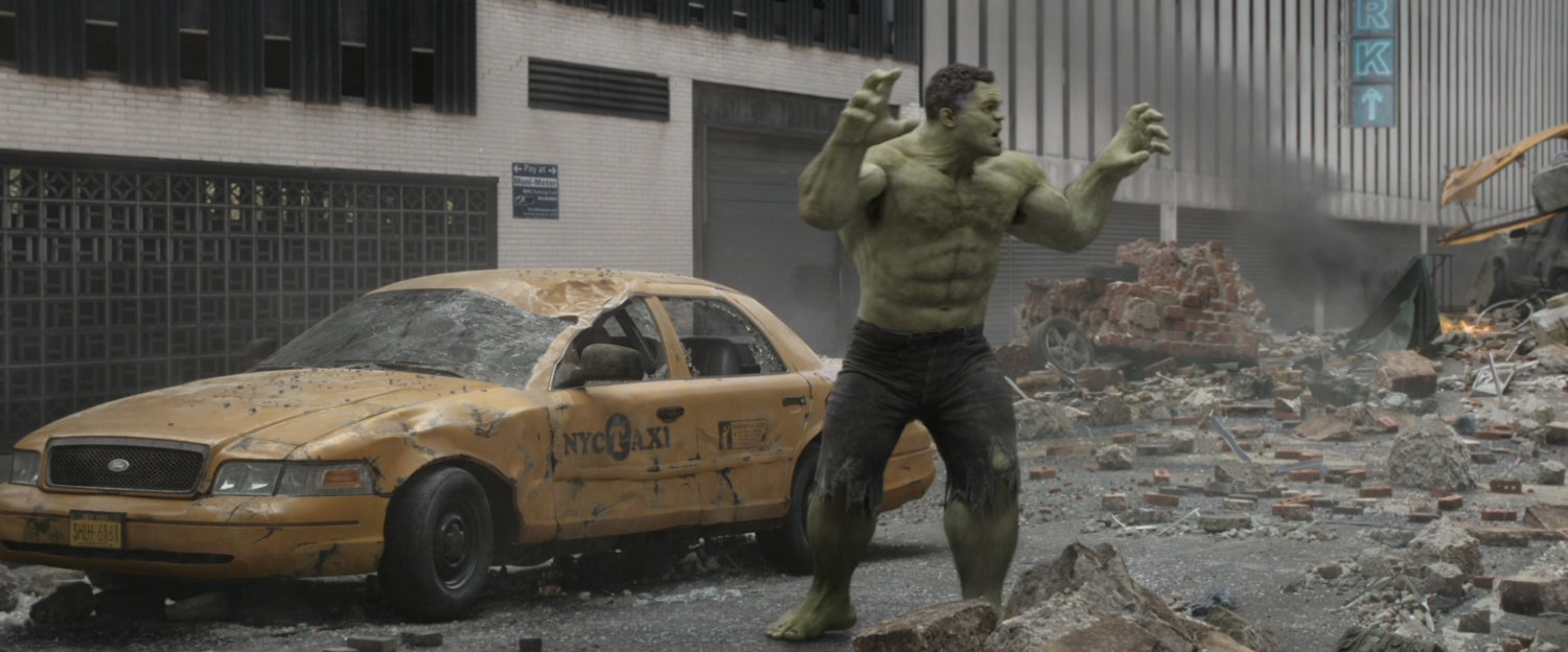 Smart Hulk strikes a pose in a rubble strewn street in New York.