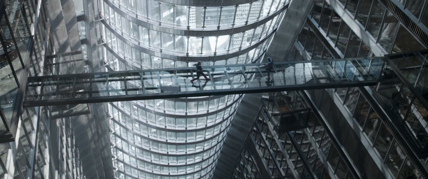 Captain Americas on a glass bridge on the 14th floor of Stark Tower.