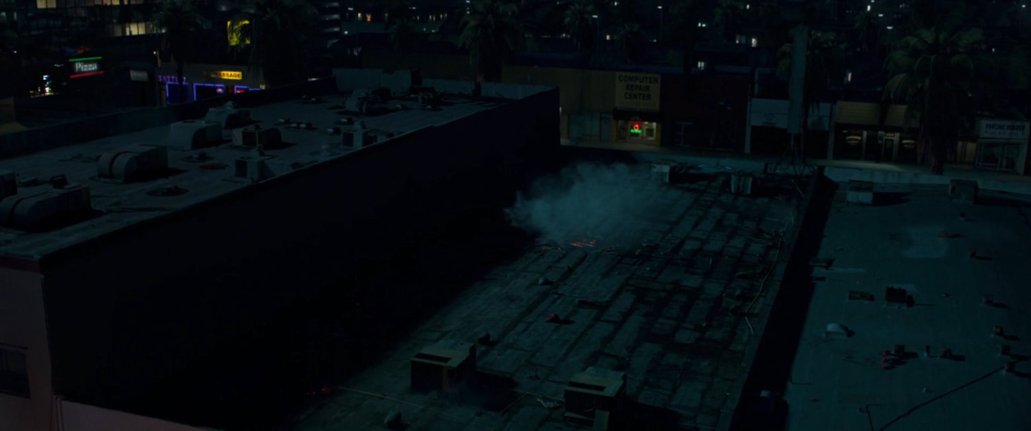 Aerial view of Blockbuster Video and street.