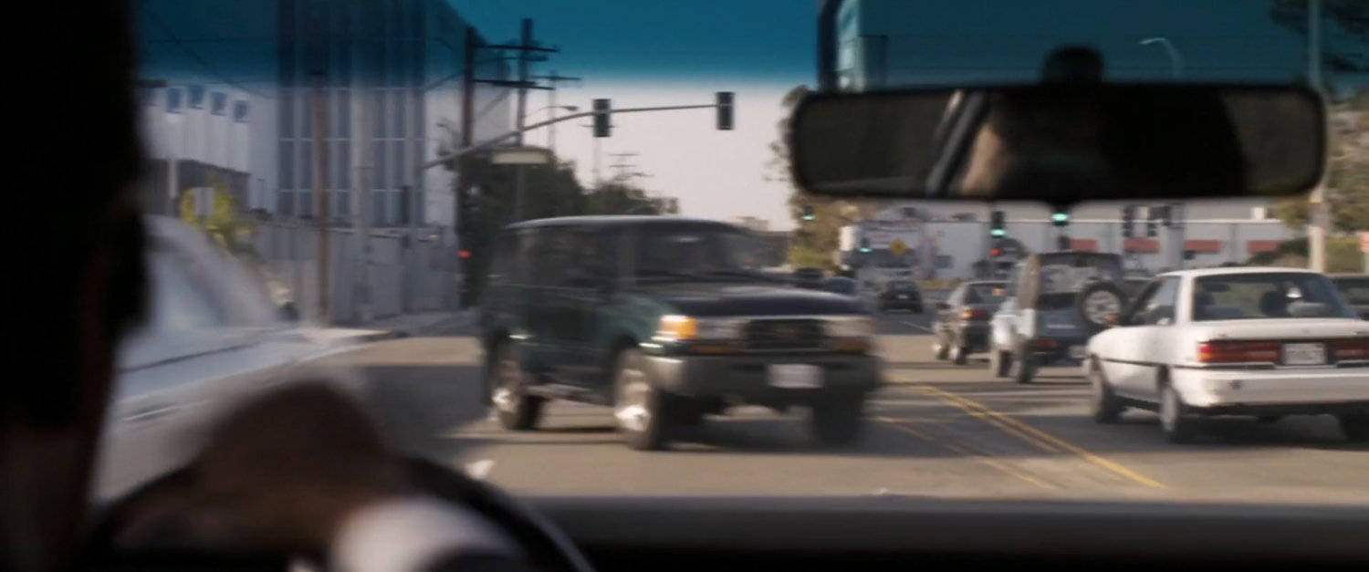 POV of oncoming cars swerving to avoid speeding car.