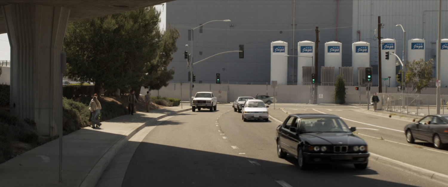 Nick Fury's car racing around corner on Los Angeles street.