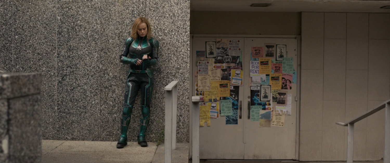 Vers checking her arm outside Los Angeles Metro station.