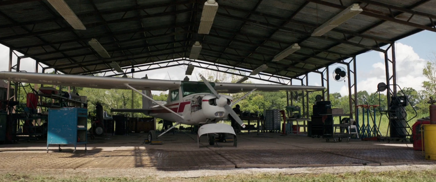 Exterior of Maria Rambeau's covered airplane hangar.